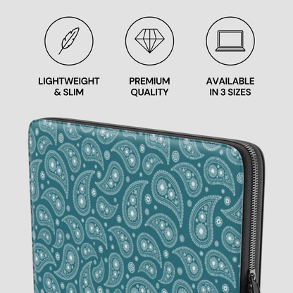 Teal paisley patterned laptop sleeve with size and quality icons on a light gray background