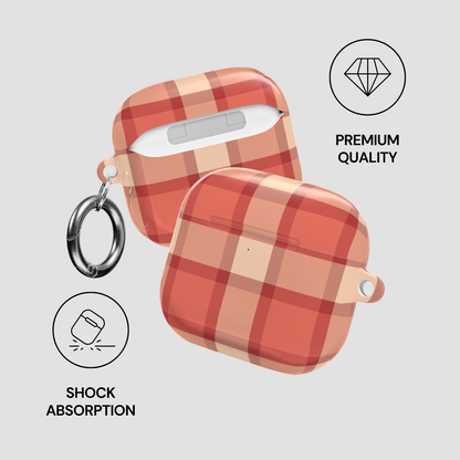 Plaid patterned case with keychain attachment on a light gray background