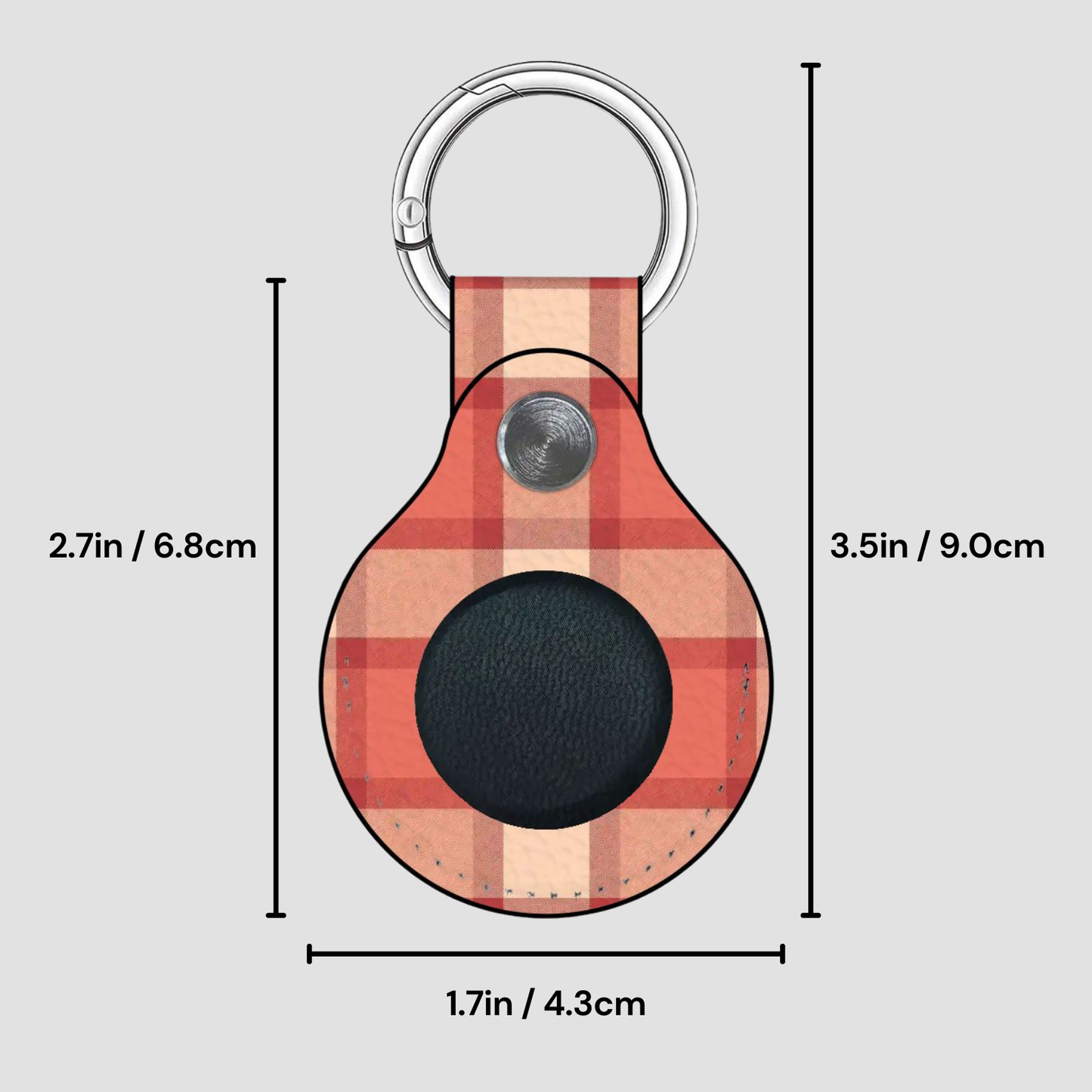 Plaid patterned keychain with measurements on a gray background