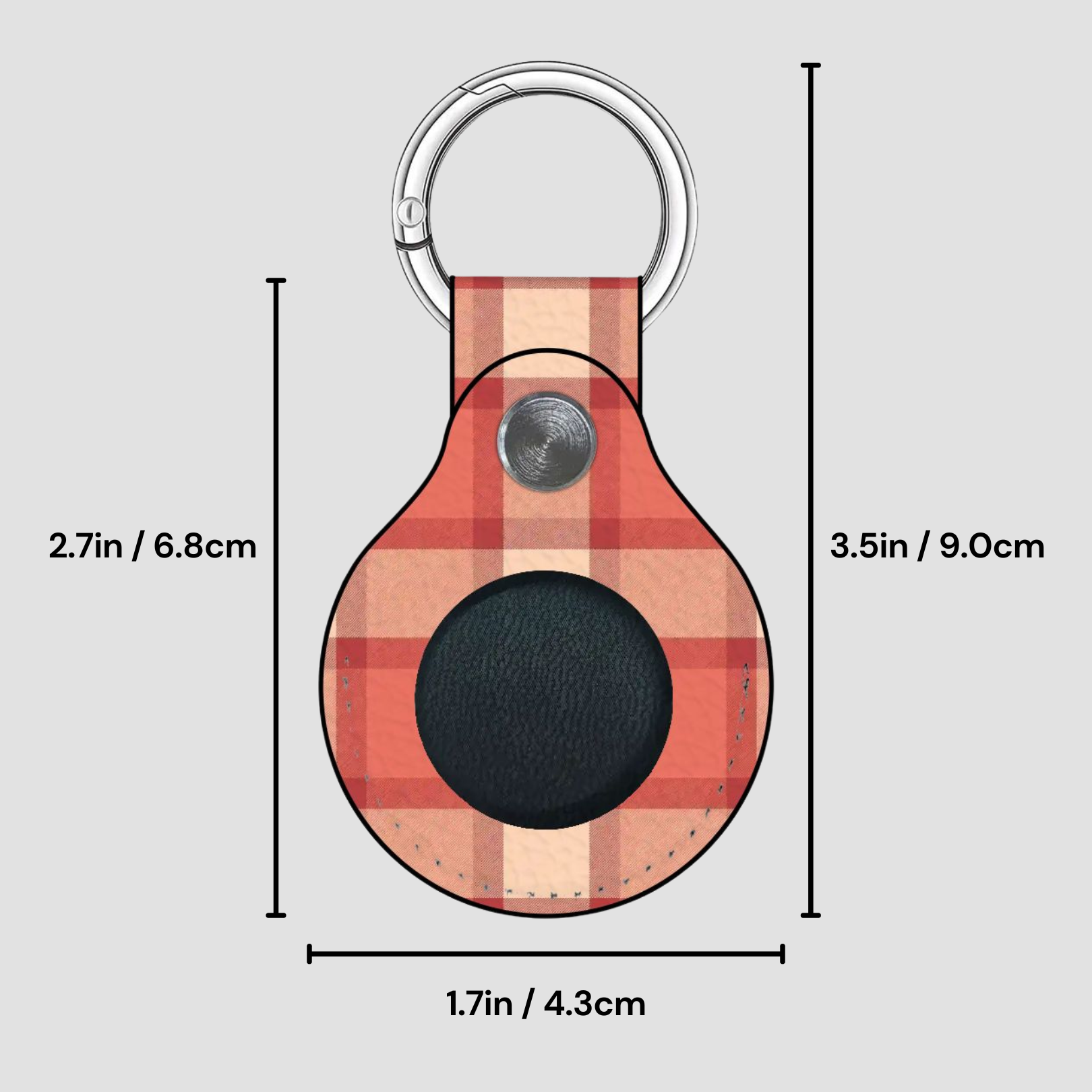 Plaid patterned keychain with measurements on a gray background