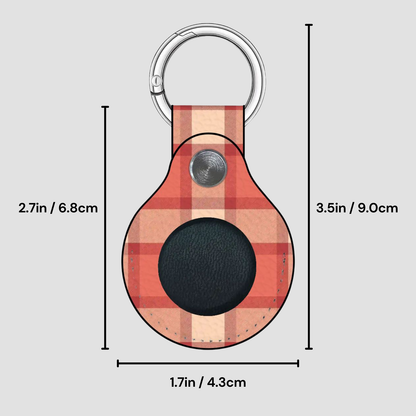 Plaid patterned keychain with measurements on a gray background