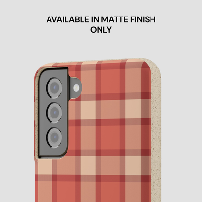 Phone case with red and beige plaid pattern on a light gray background