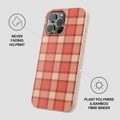 Plaid patterned phone case with text about material and print quality on a light gray background