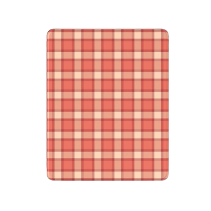 Red and beige checkered cutting board on a white background