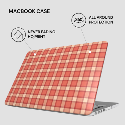 Plaid patterned MacBook case with text highlighting features on a light gray background
