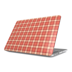 Laptop with a red and beige checkered pattern on a white background
