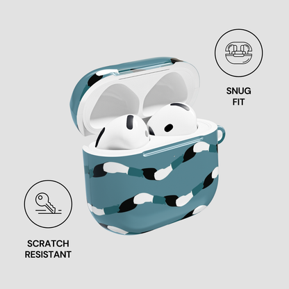 Wireless earbuds in a blue case with cow print on a light gray background