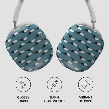 Pair of blue earbuds with a pattern on a light gray background