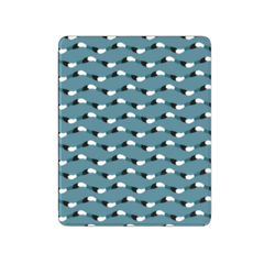 Teal blanket with black and white pattern on a white background