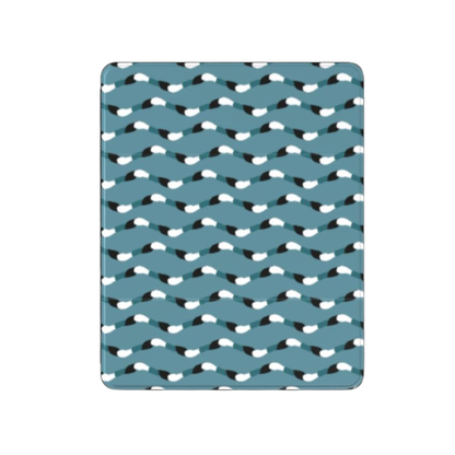 Teal blanket with black and white pattern on a white background