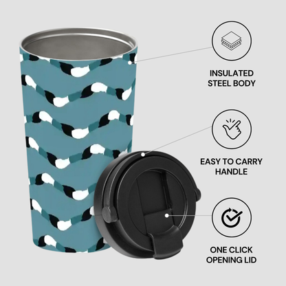 Patterned tumbler with black lid on a light gray background
