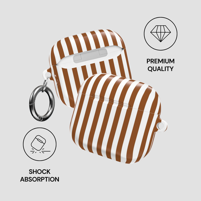 Brown and white striped airpod case with keychain on a light gray background