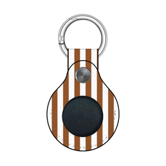 Keychain with brown and white striped design and black round component on a white background
