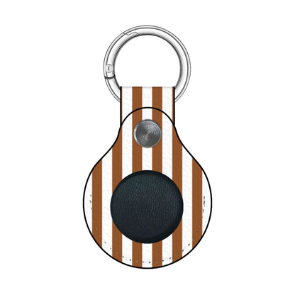 Keychain with brown and white striped design and black round component on a white background