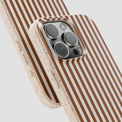 Phone case with brown and white striped pattern on a light gray background