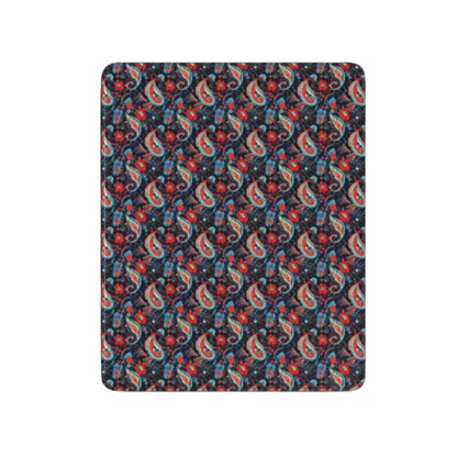 Patterned fabric swatch with red, blue, and green design on a black background