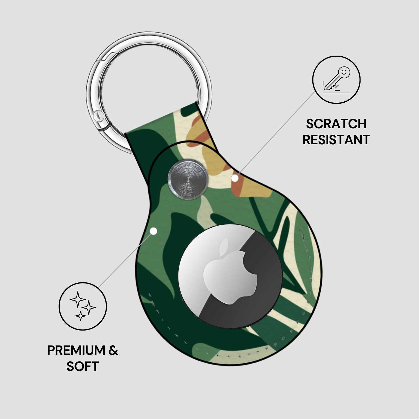 Green leaf-patterned keychain with Apple logo on a light gray background