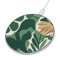 Round wireless charging pad with floral design on a white background