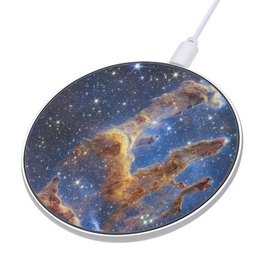 Wireless charging pad with space-themed design on a white background