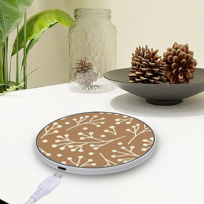 Wireless charging pad with floral pattern on a table with decorative items