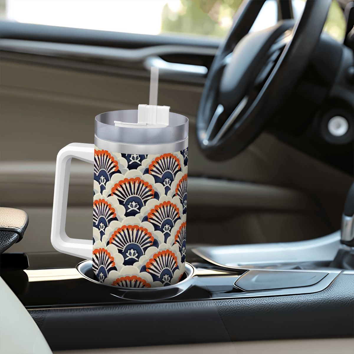 Patterned mug on a car dashboard with steering wheel in the background