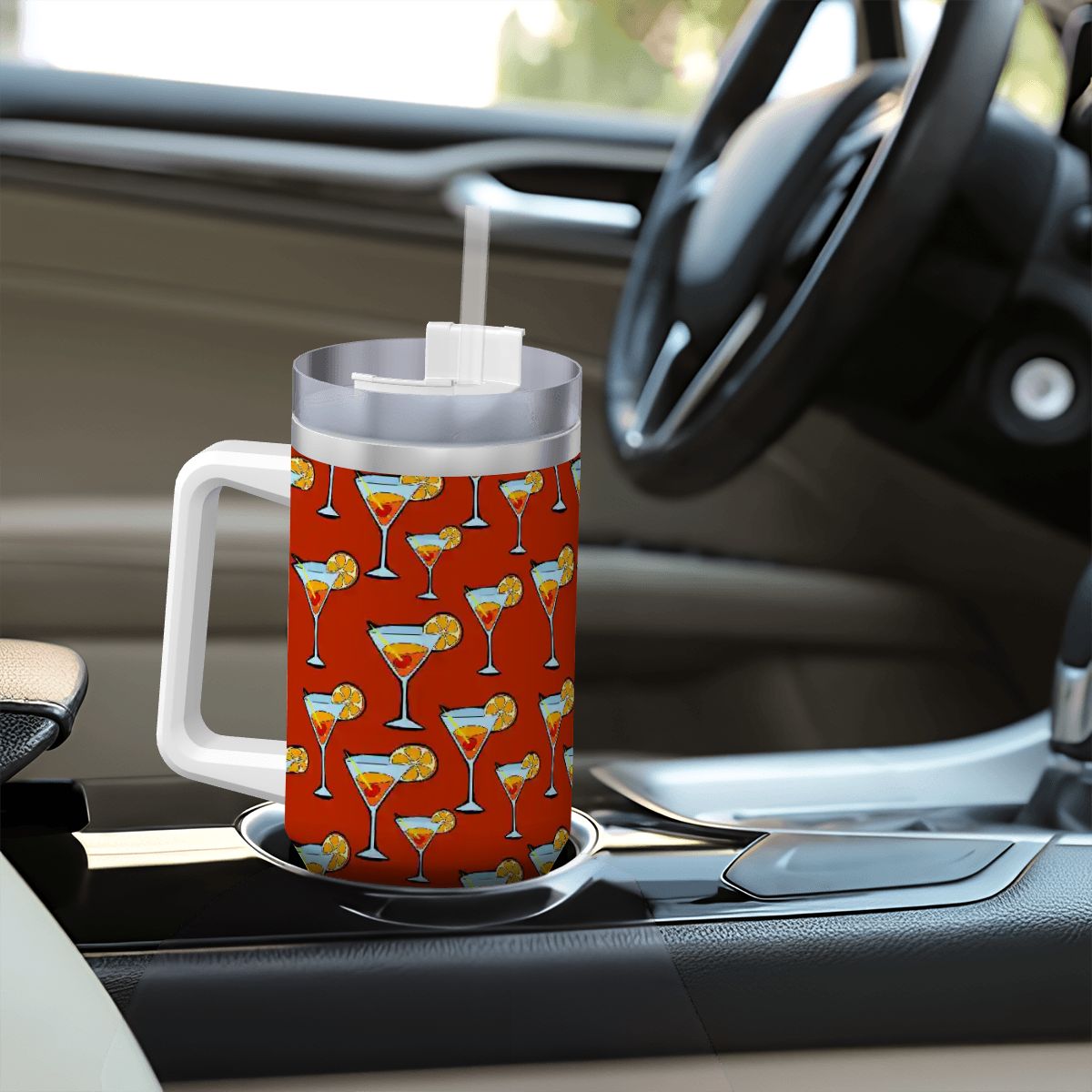 Tumbler with cocktail pattern on a car dashboard