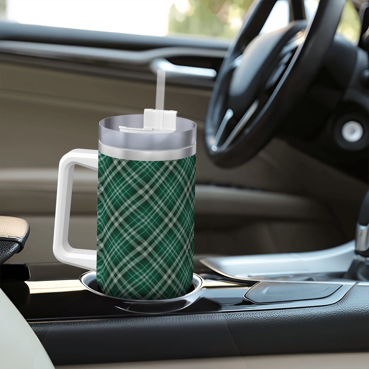 Green plaid mug with a straw on a car dashboard | Casenari