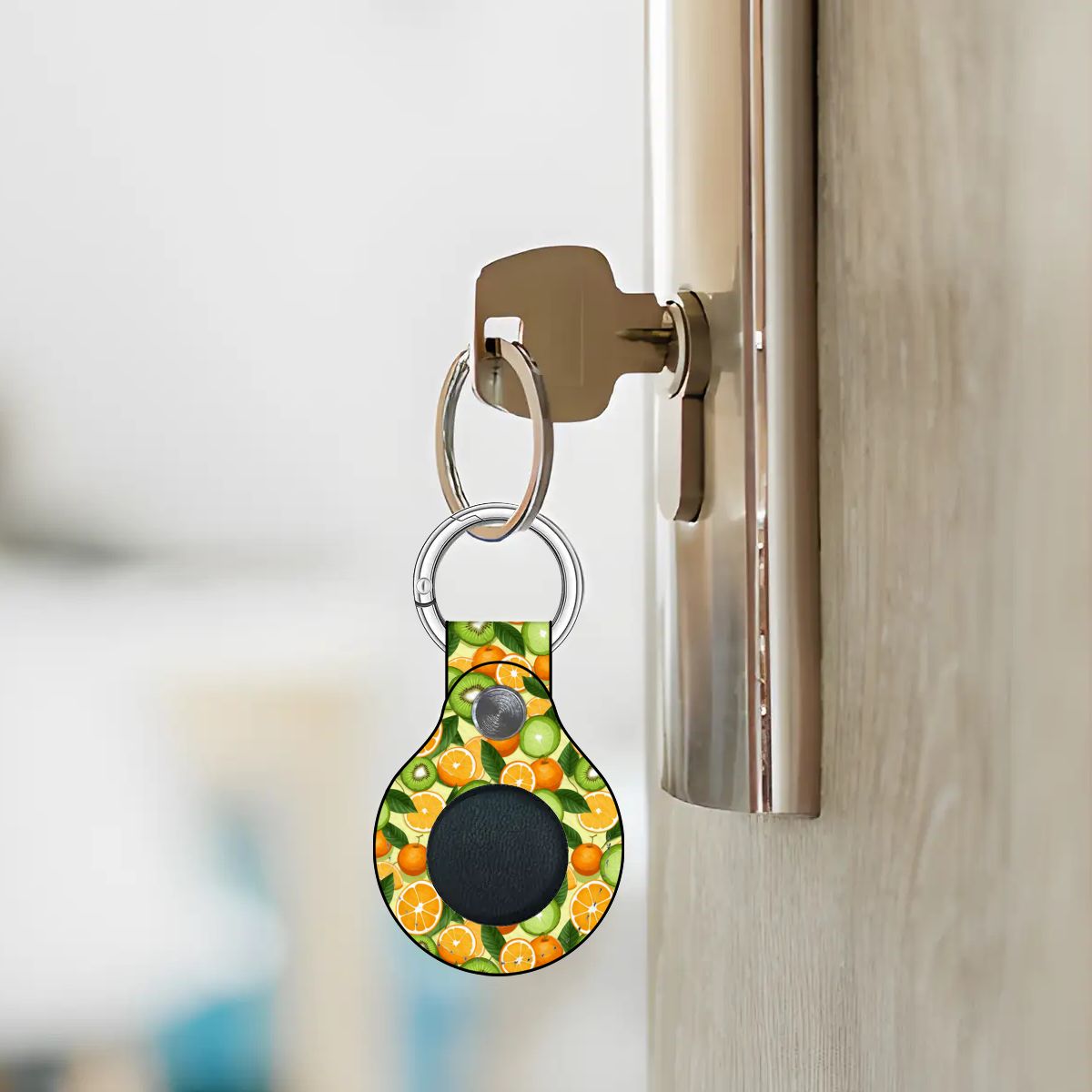 Keychain with avocado pattern attached to a door handle