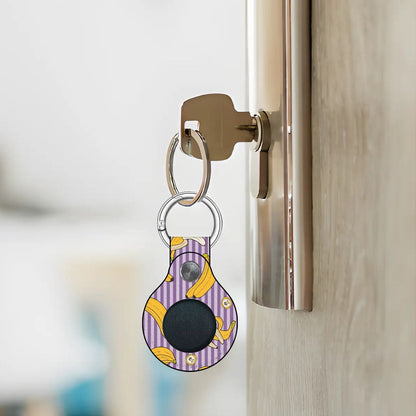 Keychain with a tartan pattern attached to a door handle.