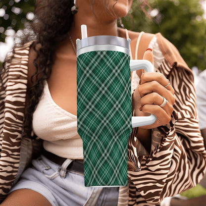 Person holding a green plaid-patterned tumbler outdoors | Casenari