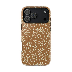 Phone case with a floral pattern on a brown background