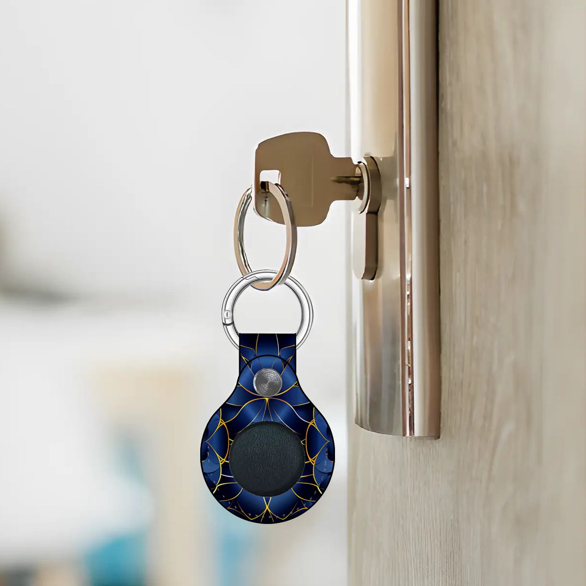 Keychain with a blue marble pattern attached to a door handle.