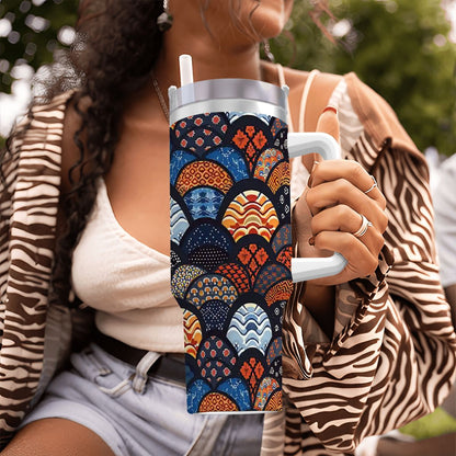 Person holding a colorful patterned tumbler outdoors | Casenari 