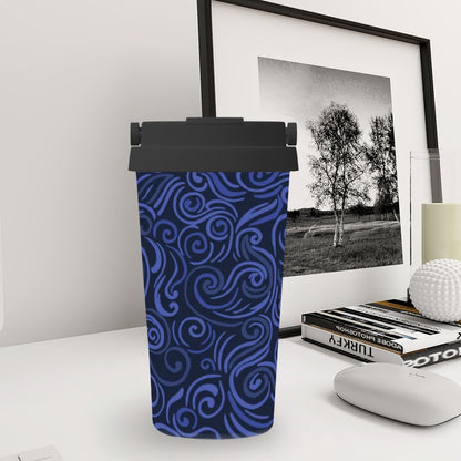 Blue patterned tumbler on a desk with a framed picture and books in the background