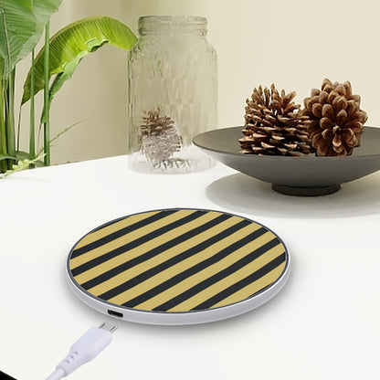 Black and gold striped wireless charging pad on a white surface with decorative elements.