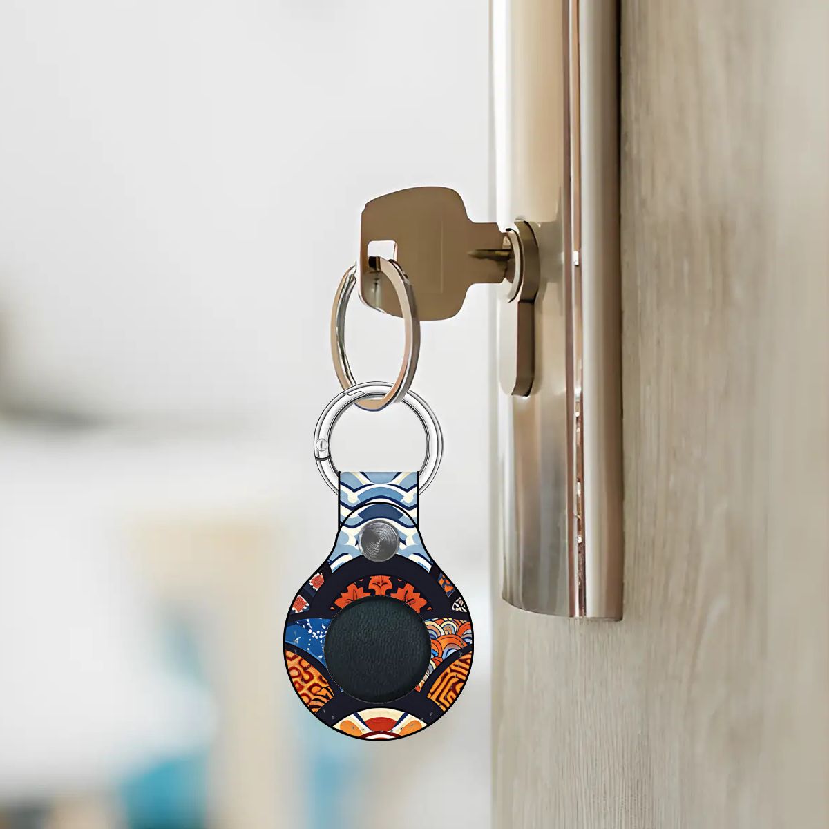 Keychain with a colorful design attached to a doorknob. | Casenari