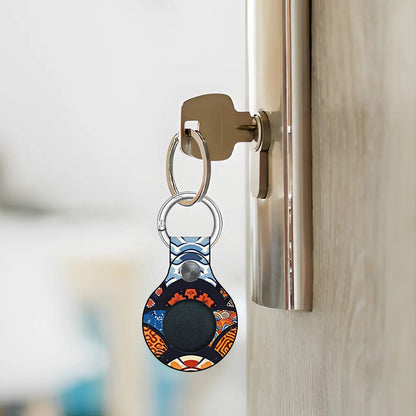 Keychain with a colorful design attached to a doorknob. | Casenari