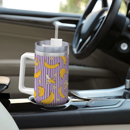 Tumbler with banana pattern on a car dashboard