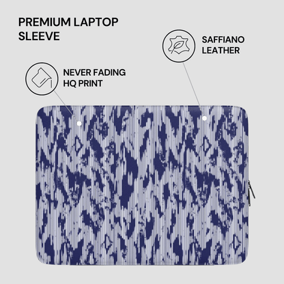Laptop sleeve with saffiano leather finish and blue abstract pattern on a light gray background