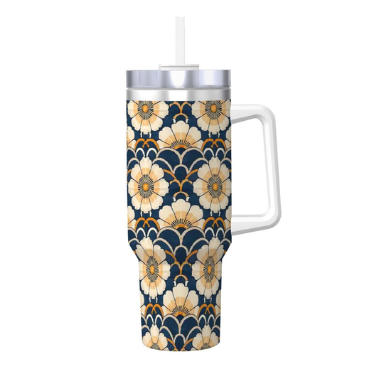 Floral patterned tumbler with handle on a white background